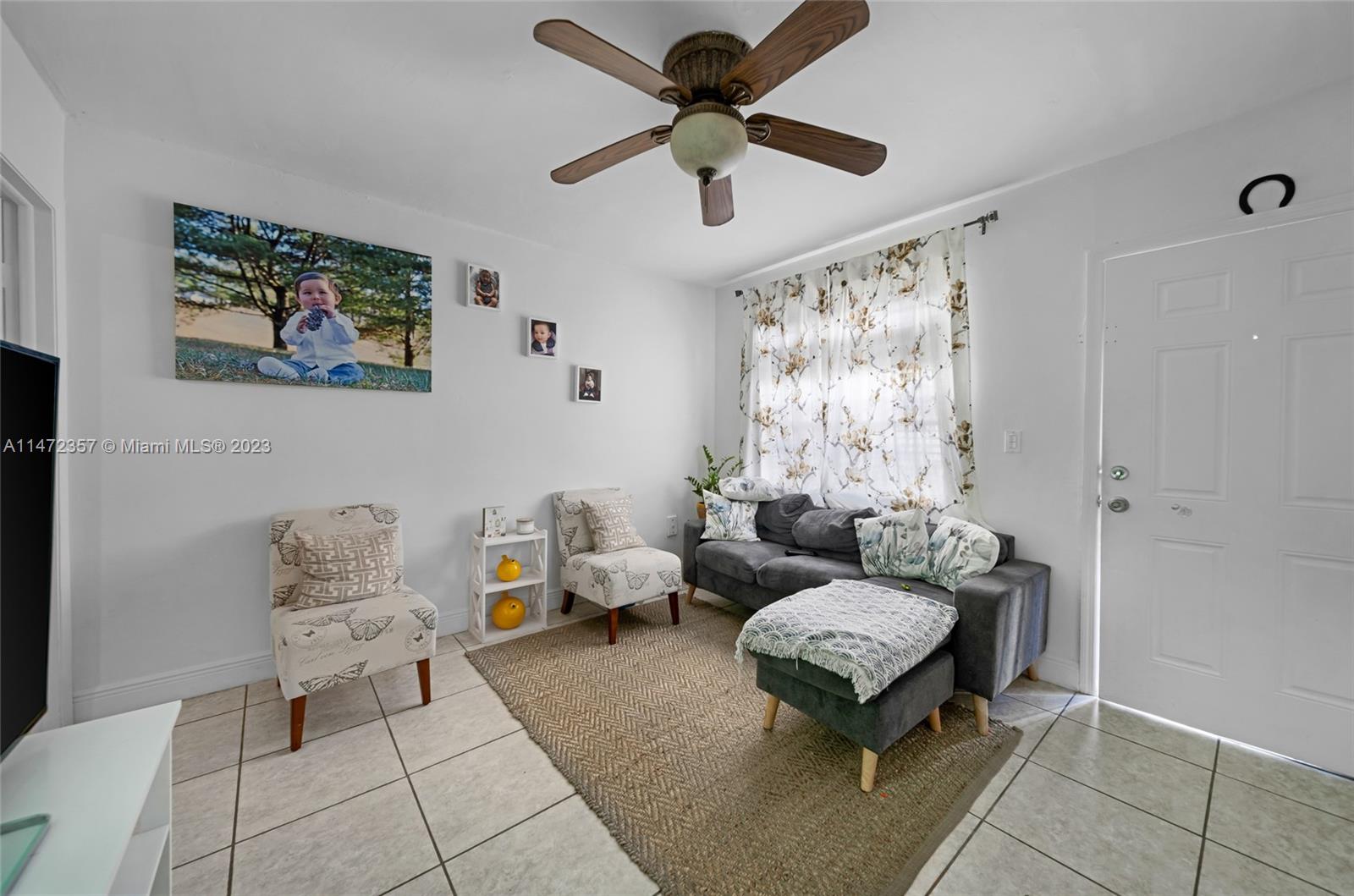 1137 Northwest 2nd Street Miami, FL 33128 - Photo 18 of 32 a living room with furniture and a window