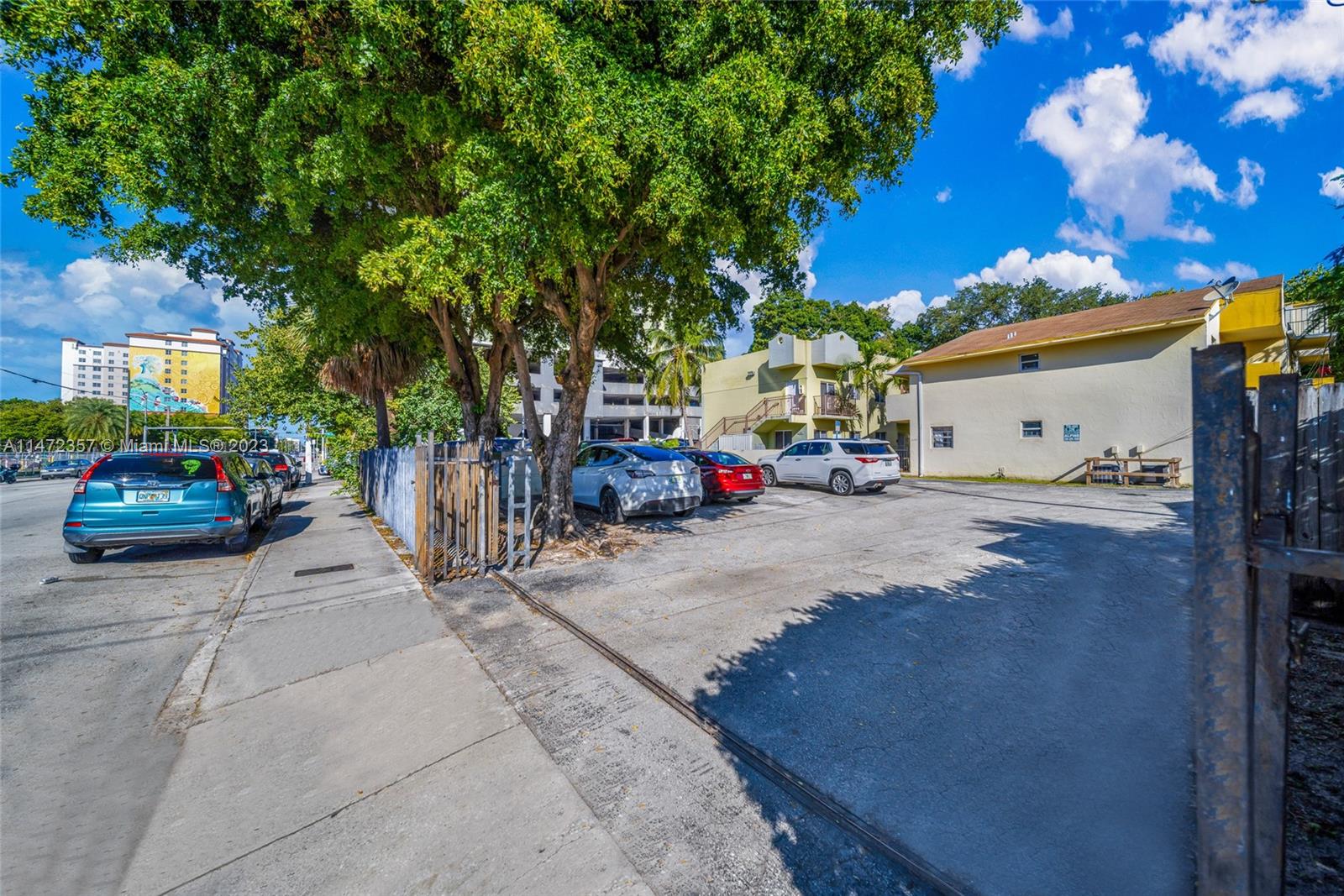 1137 Northwest 2nd Street Miami, FL 33128 - Photo 2 of 32 a view of a street with cars