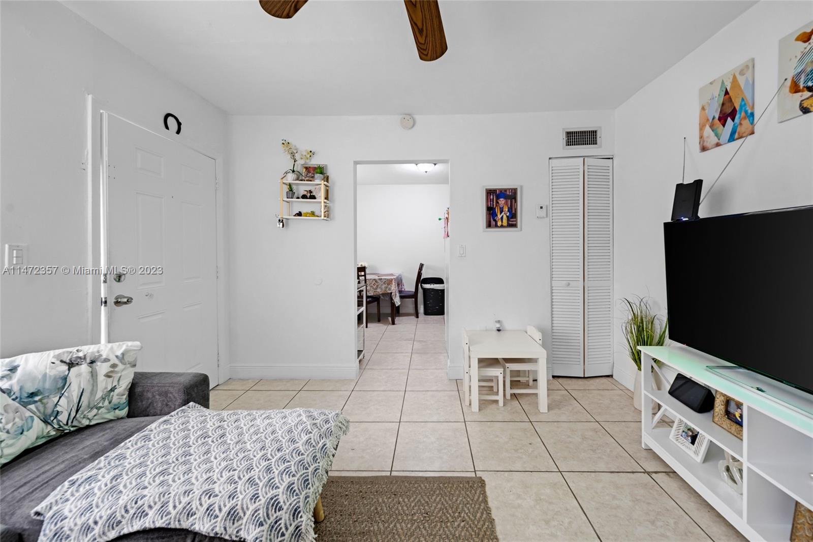 1137 Northwest 2nd Street Miami, FL 33128 - Photo 21 of 32 a bedroom with furniture and a flat screen tv