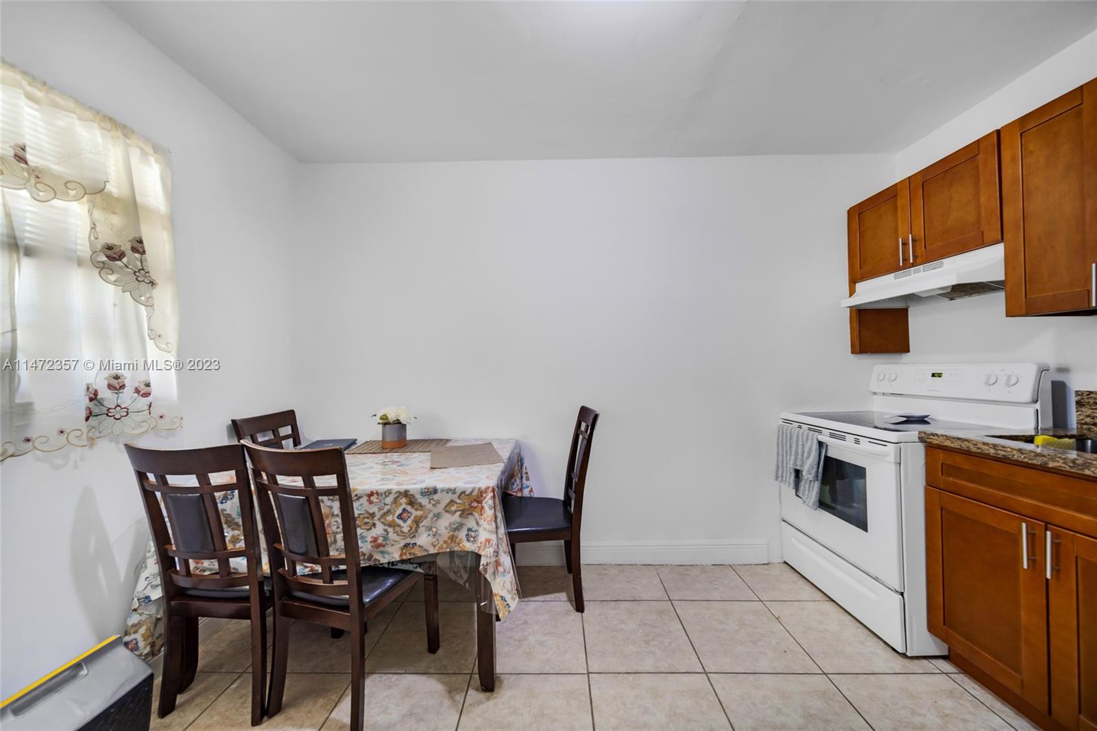 1137 Northwest 2nd Street Miami, FL 33128 - Photo 27 of 32 a view of a dining room with furniture and wooden floor