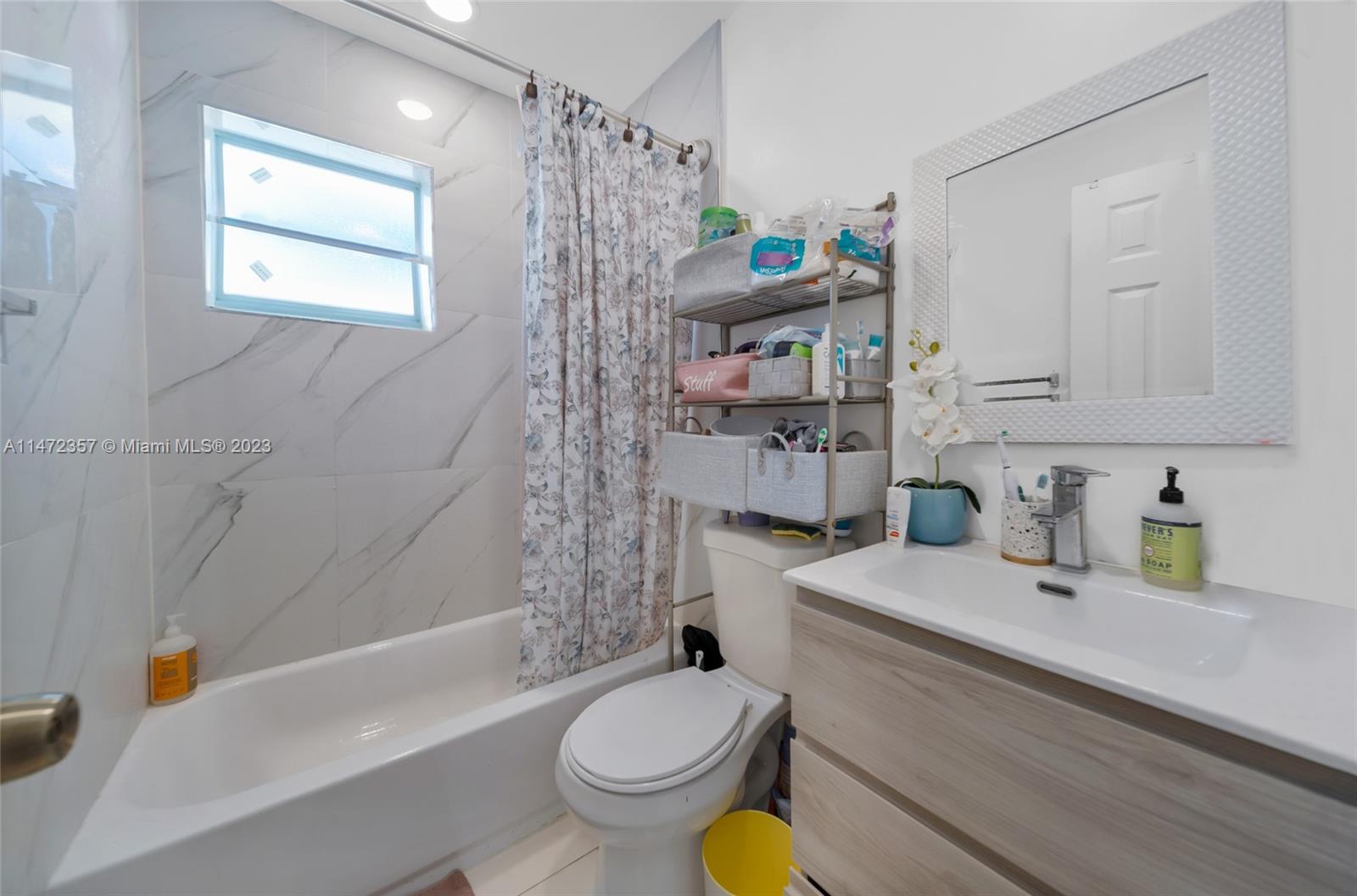 1137 Northwest 2nd Street Miami, FL 33128 - Photo 7 of 32 a bathroom with a sink toilet and shower