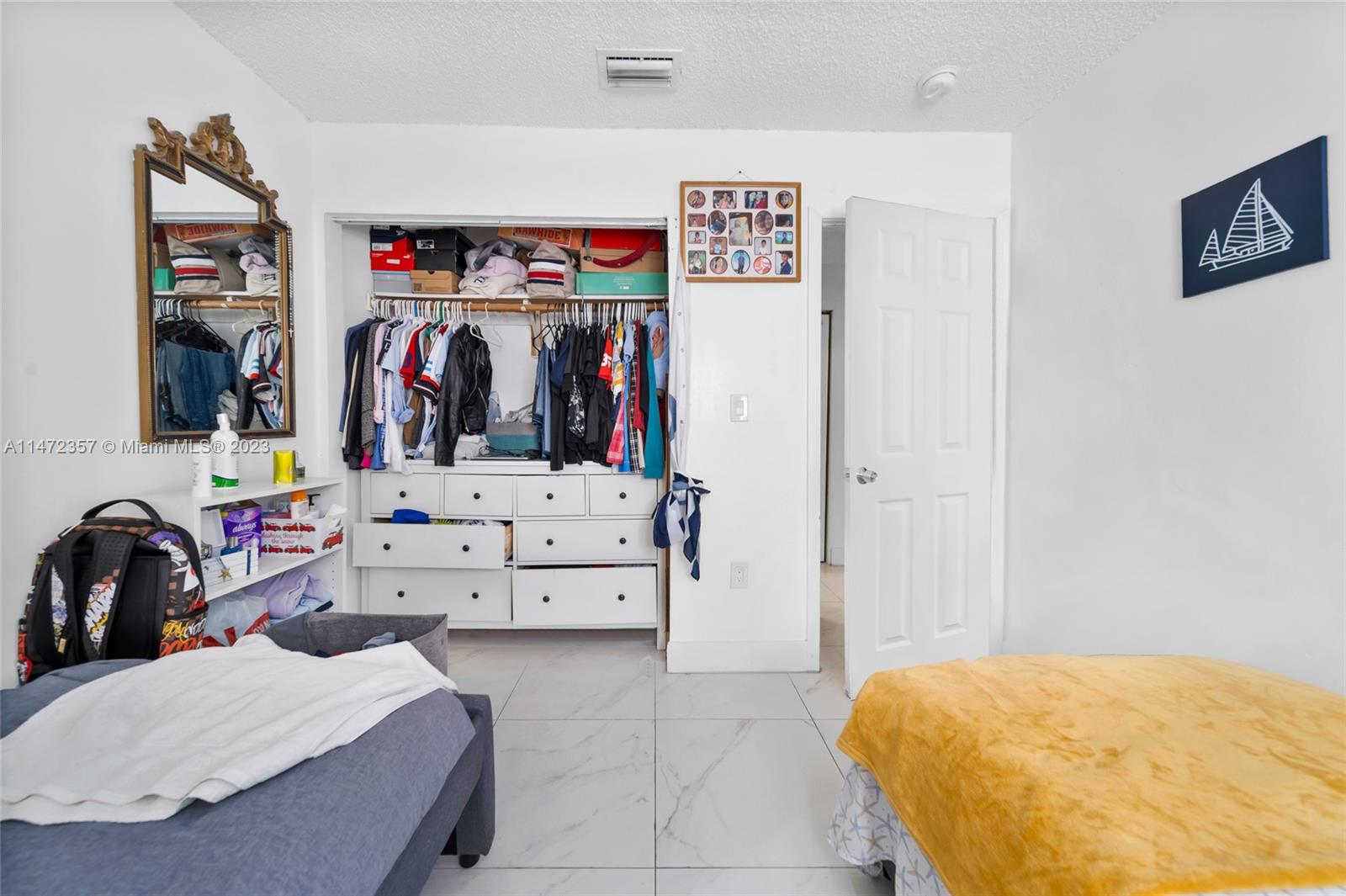 1137 Northwest 2nd Street Miami, FL 33128 - Photo 9 of 32 a bedroom with a bed and a view of bathroom