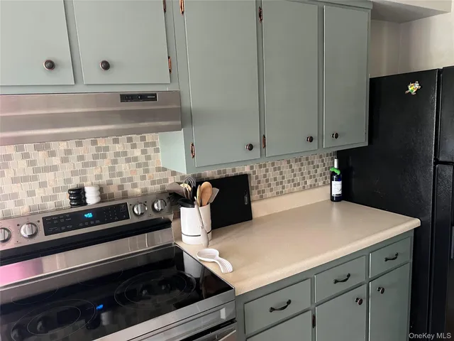 a kitchen with a cabinets and a stove