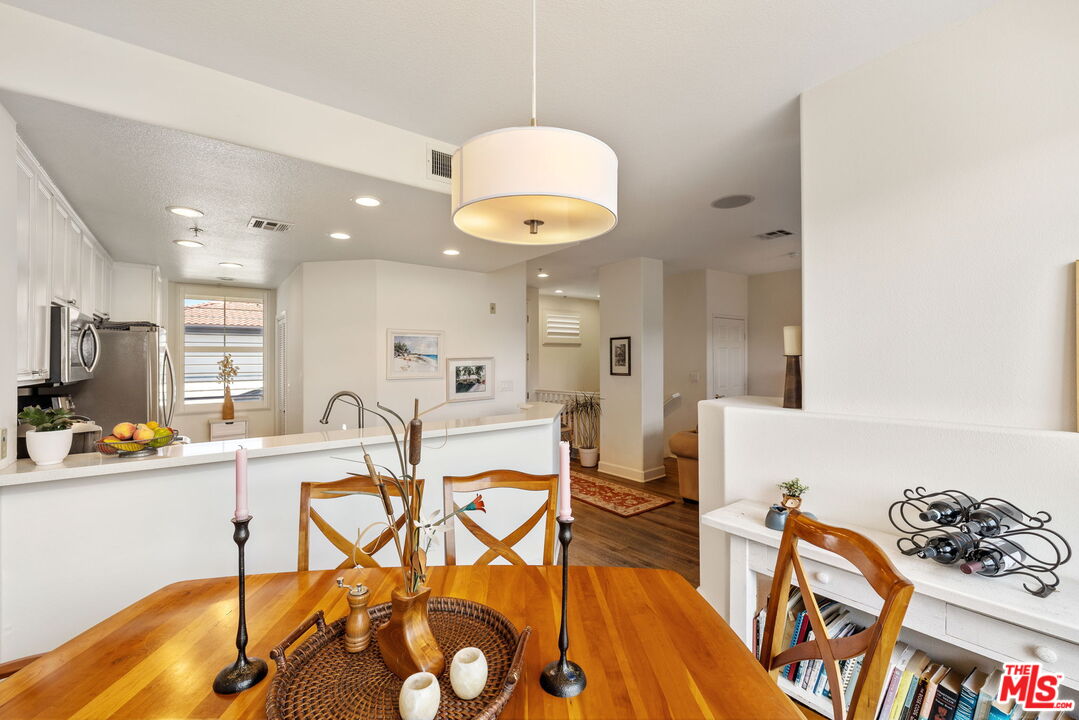 12963 West Runway Road, Unit 408 Playa Vista, CA 90094 - Photo 12 of 44 a very nice looking dining room with a table and chairs