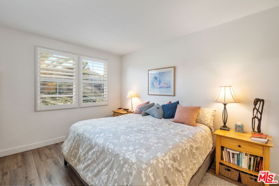 12963 West Runway Road, Unit 408 Playa Vista, CA 90094 - Photo 19 of 44 a bedroom with a bed a dresser and a window