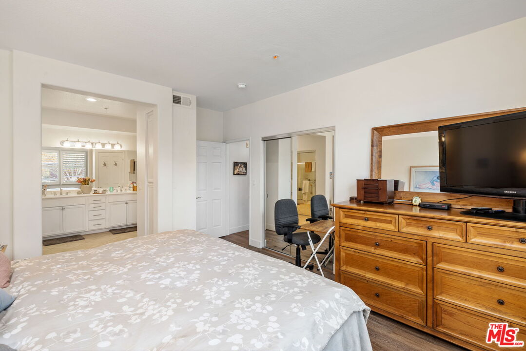 12963 West Runway Road, Unit 408 Playa Vista, CA 90094 - Photo 20 of 44 a bedroom with a bed and a flat screen tv
