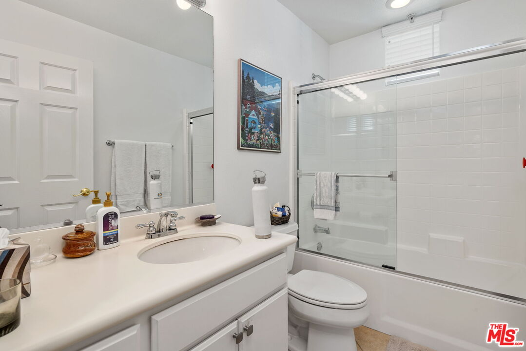 12963 West Runway Road, Unit 408 Playa Vista, CA 90094 - Photo 24 of 44 a bathroom with a sink toilet and shower