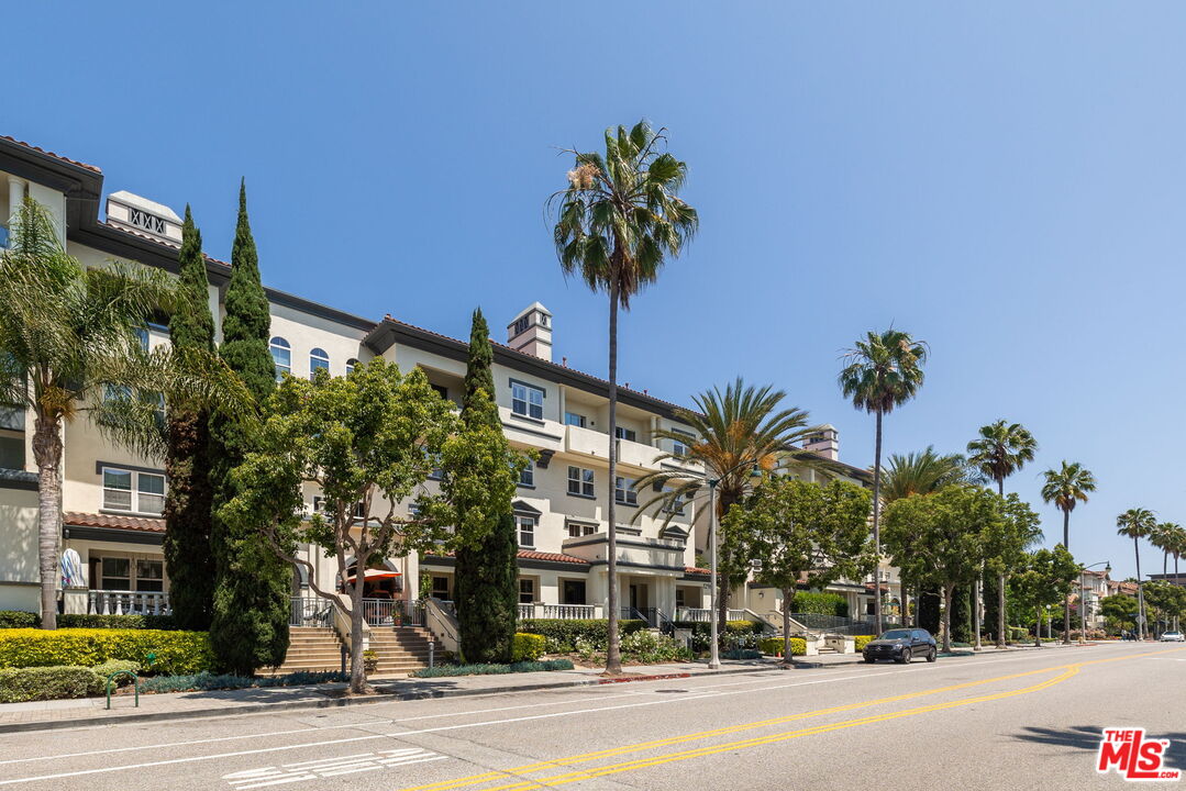 12963 West Runway Road, Unit 408 Playa Vista, CA 90094 - Photo 30 of 44 a view of a street with a building and a street sign