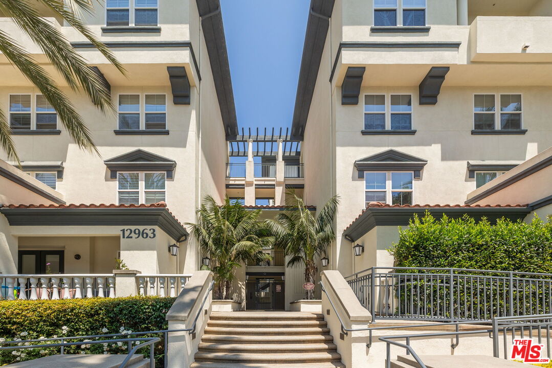 12963 West Runway Road, Unit 408 Playa Vista, CA 90094 - Photo 3 of 44 a view of a brick building next to a yard