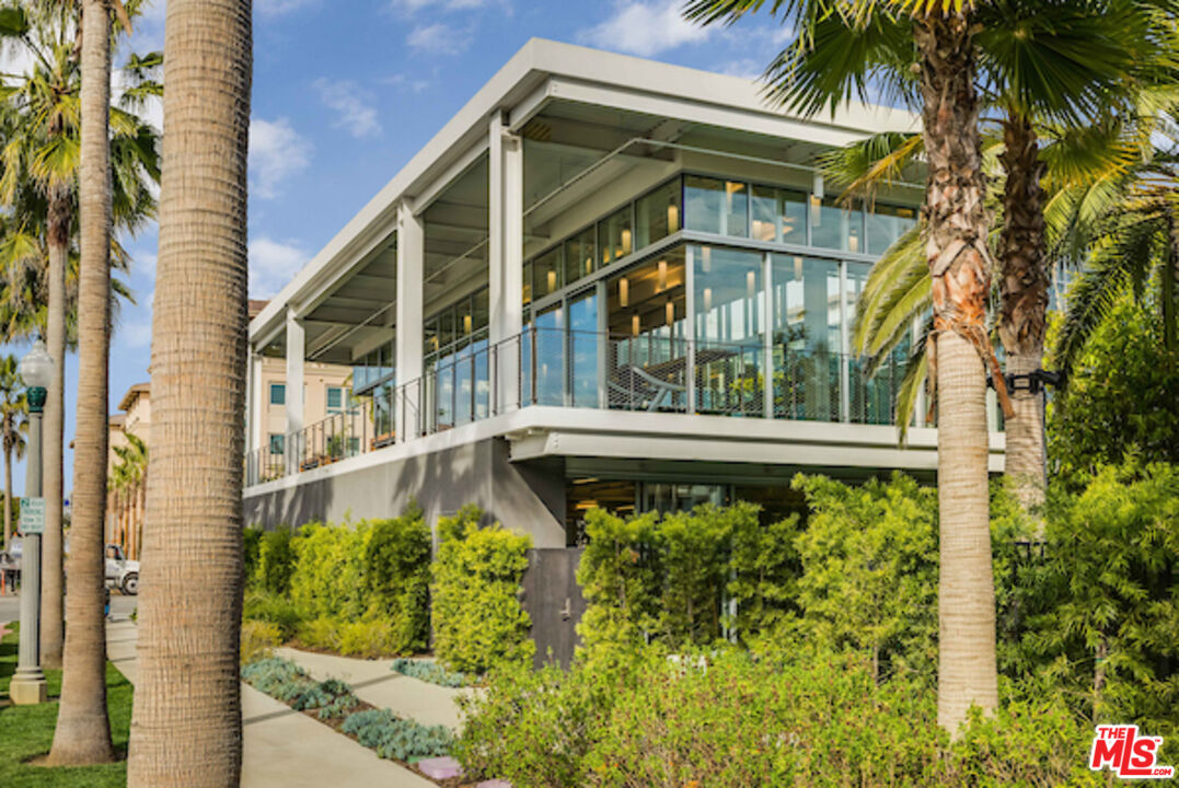12963 West Runway Road, Unit 408 Playa Vista, CA 90094 - Photo 33 of 44 a front view of a house with a yard