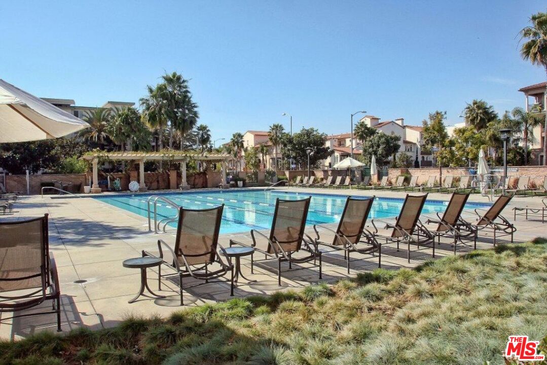 12963 West Runway Road, Unit 408 Playa Vista, CA 90094 - Photo 37 of 44 a view of a swimming pool with chairs