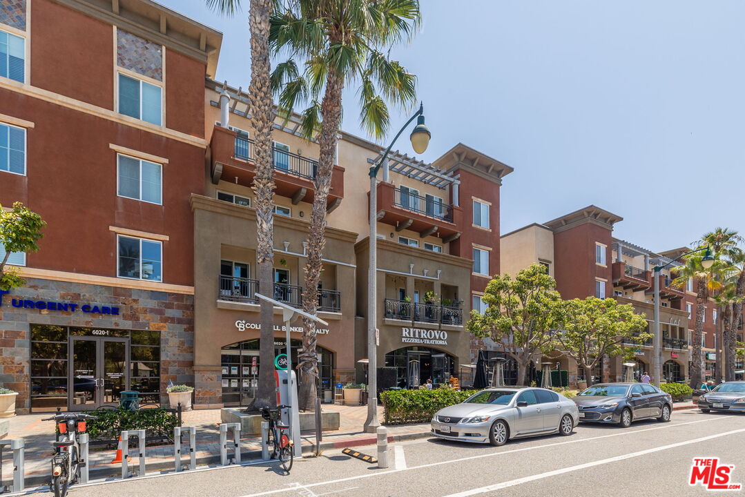 12963 West Runway Road, Unit 408 Playa Vista, CA 90094 - Photo 40 of 44 a city street lined with buildings and cars
