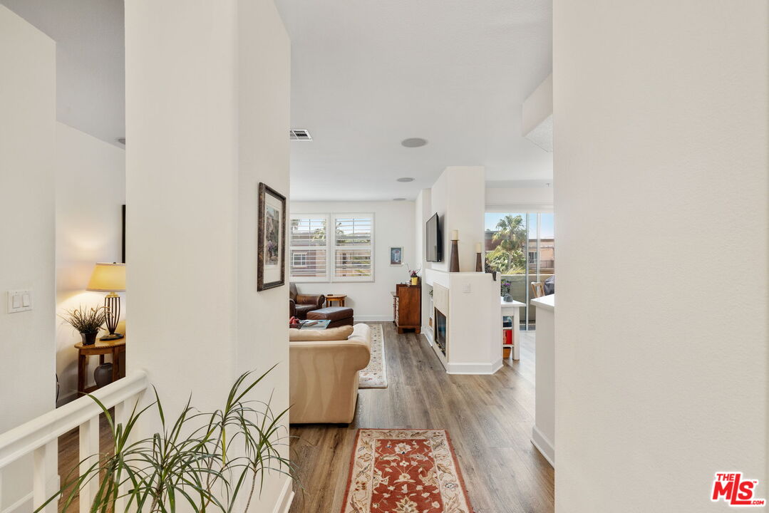 12963 West Runway Road, Unit 408 Playa Vista, CA 90094 - Photo 4 of 44 a living room with furniture and wooden floor