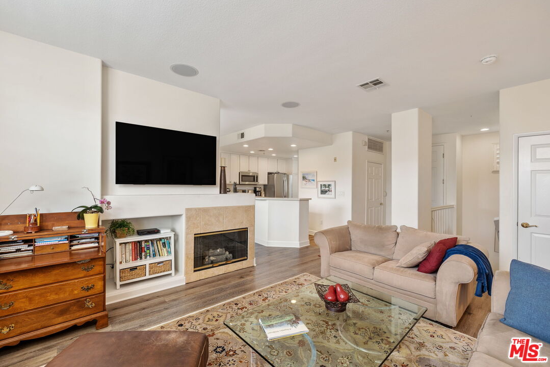 12963 West Runway Road, Unit 408 Playa Vista, CA 90094 - Photo 7 of 44 a living room with furniture and a flat screen tv