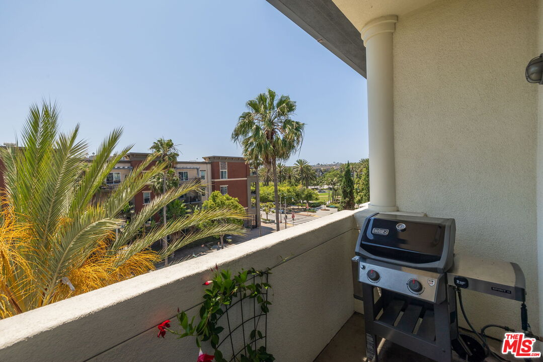 12963 West Runway Road, Unit 408 Playa Vista, CA 90094 - Photo 10 of 44 a potted plant sitting on a table and chair