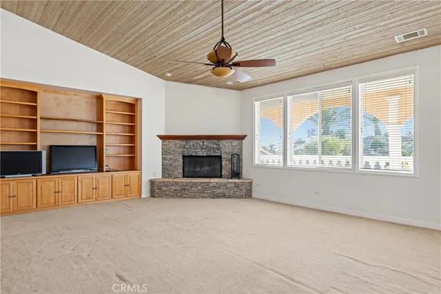 a kitchen with stainless steel appliances granite countertop a refrigerator a stove and a sink