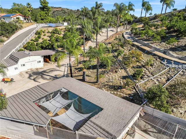 a view of a backyard with sitting area