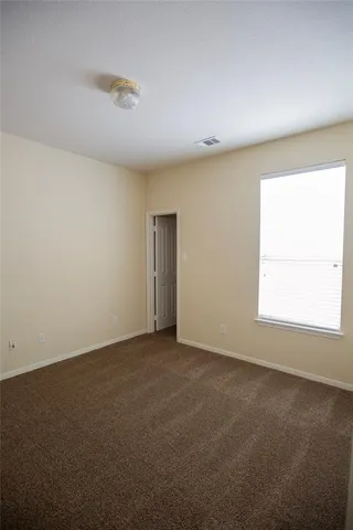 an empty room with a empty space and a window