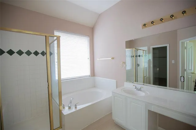 a bathroom with a bathtub and a sink