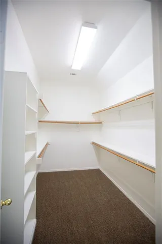 a view of an empty room with stairs