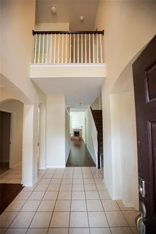 a view of an empty room and a window