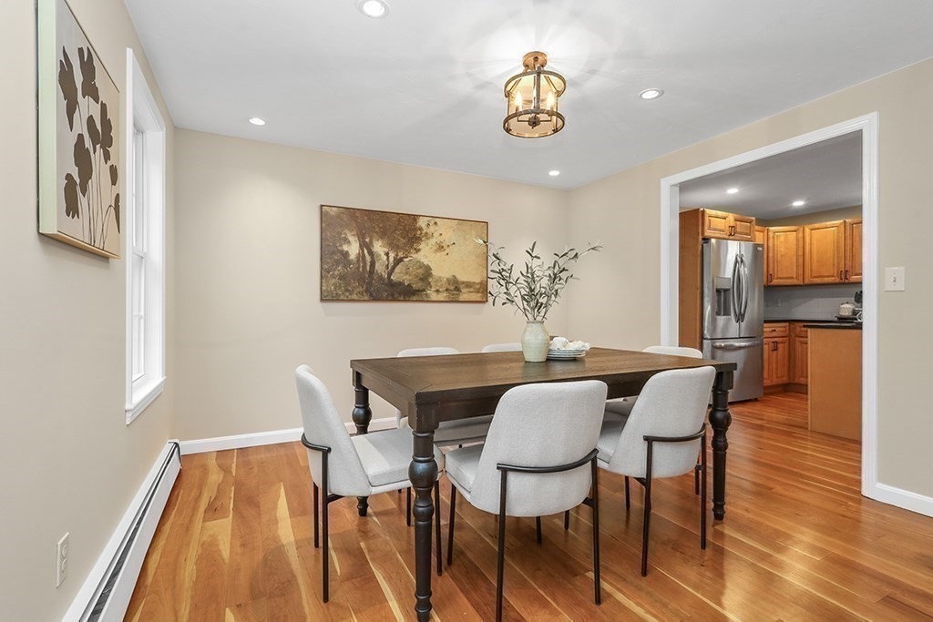 94 Hudson Road Stow, MA 01775 - Photo 13 of 30 a view of a dining room with furniture and wooden floor