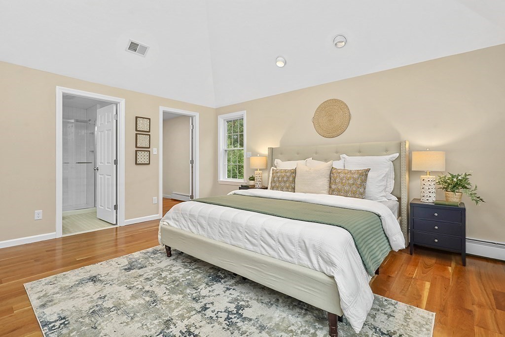 94 Hudson Road Stow, MA 01775 - Photo 19 of 30 a bedroom with a bed and wooden floor