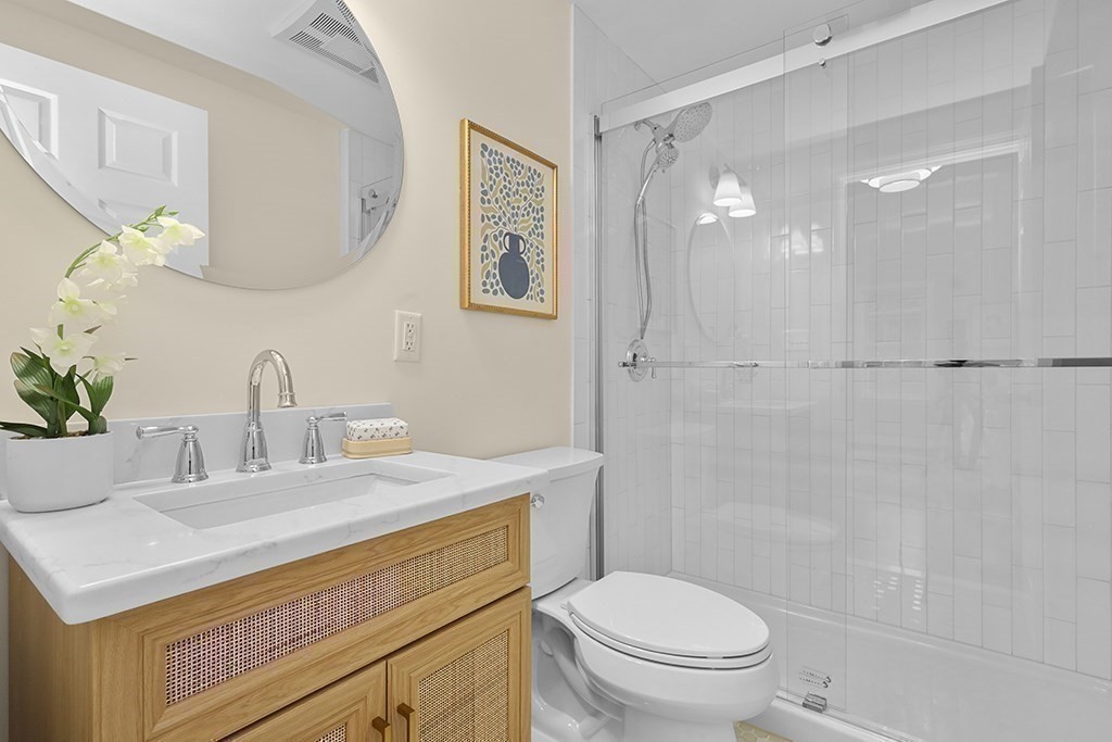 94 Hudson Road Stow, MA 01775 - Photo 21 of 30 a bathroom with a sink a toilet and a mirror