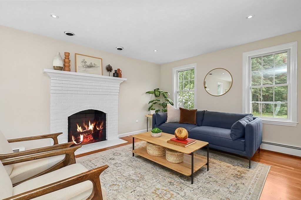 94 Hudson Road Stow, MA 01775 - Photo 4 of 30 a living room with furniture and a fireplace