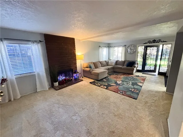 a view of livingroom with furniture and front door