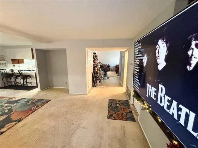 a dining room with furniture and a clock