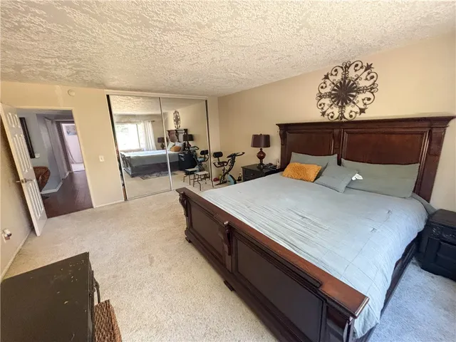 a living room with furniture and a mirror
