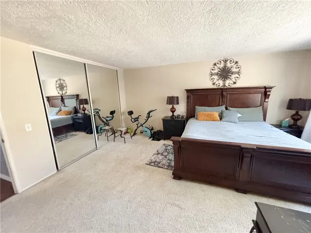 a bedroom with bed and window