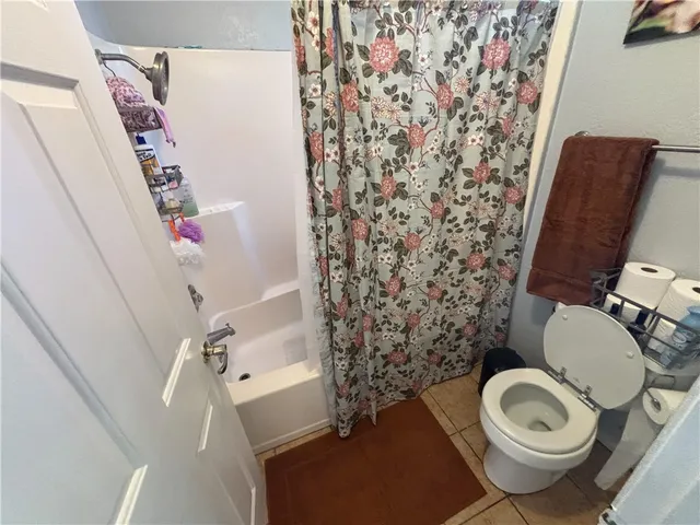 a bathroom with a double vanity sink a mirror and shower