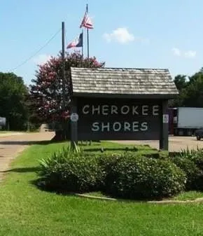 a view of a house with a yard and potted plants