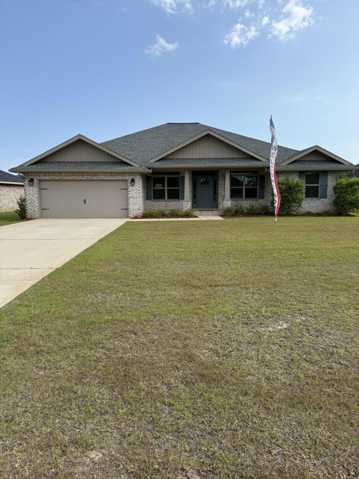 a front view of a house with yard