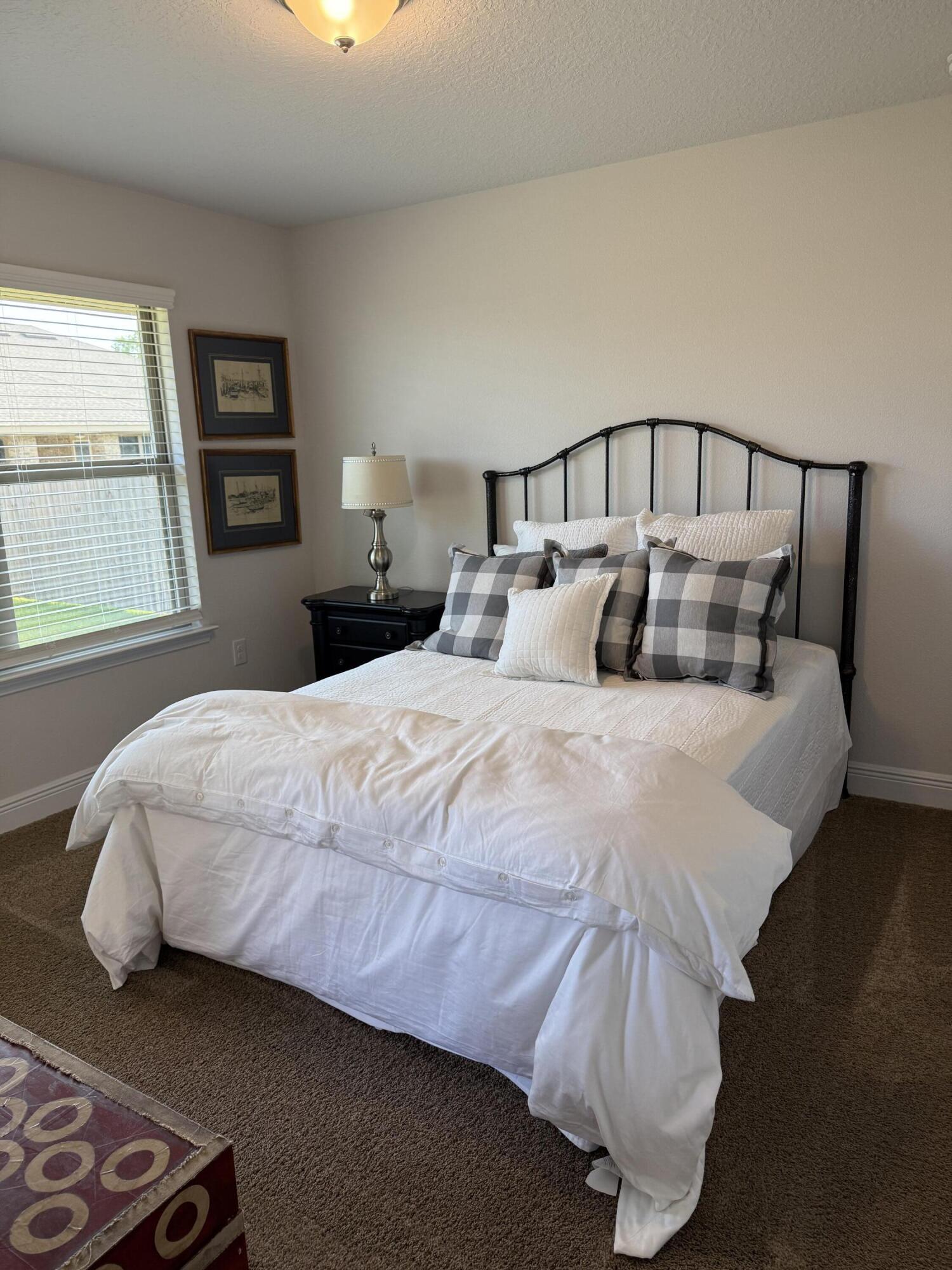 5825 Crestlake Drive Crestview, FL 32536 - Photo 14 of 29 a bedroom with a bed and window