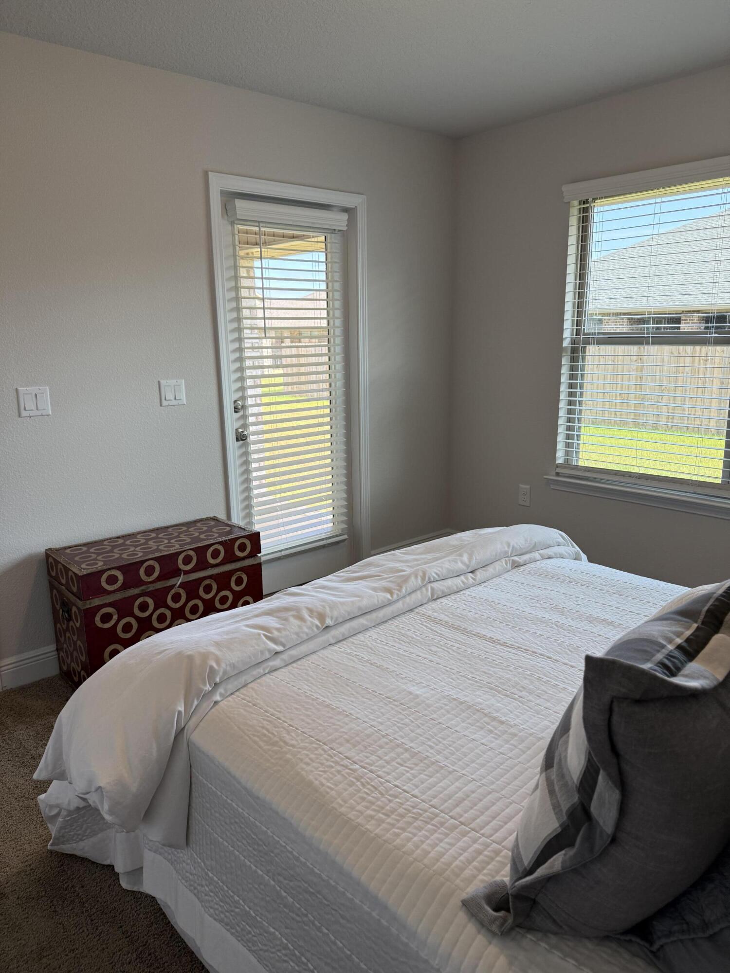 5825 Crestlake Drive Crestview, FL 32536 - Photo 15 of 29 a bedroom with a bed and window