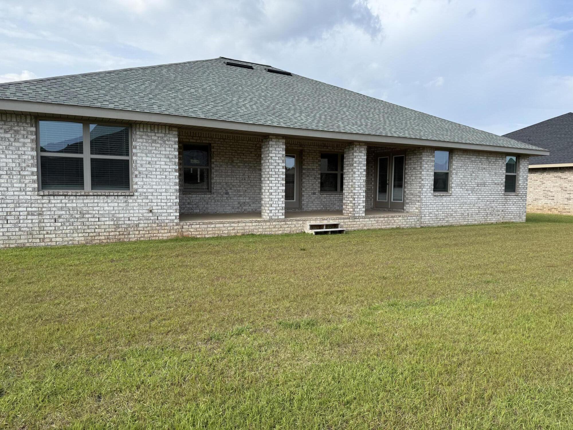 5825 Crestlake Drive Crestview, FL 32536 - Photo 26 of 29 a front view of house with yard