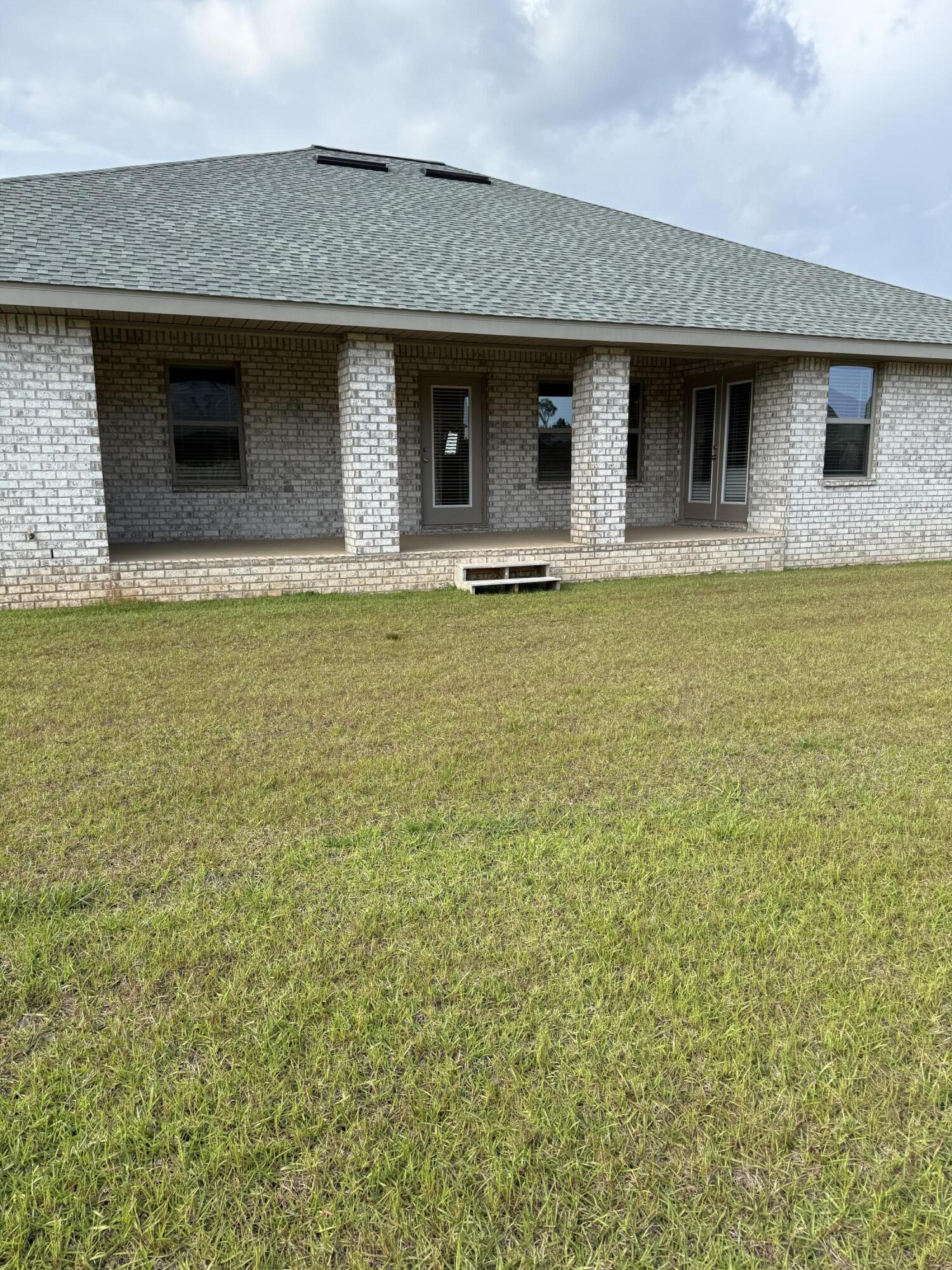 5825 Crestlake Drive Crestview, FL 32536 - Photo 27 of 29 a front view of house with yard
