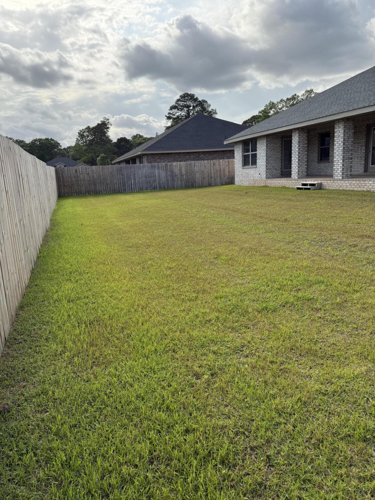 5825 Crestlake Drive Crestview, FL 32536 - Photo 28 of 29 a view of a house with a yard