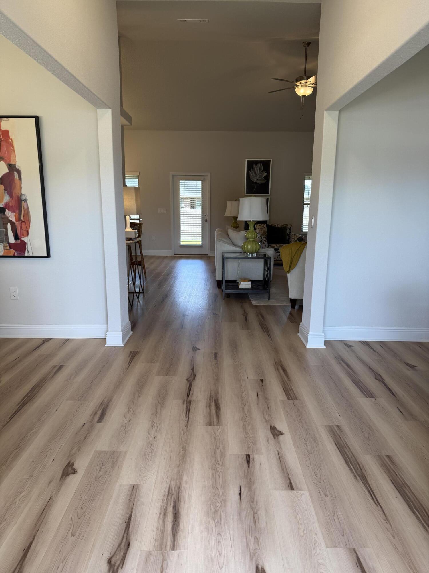 5825 Crestlake Drive Crestview, FL 32536 - Photo 4 of 29 a living room with furniture and a fireplace