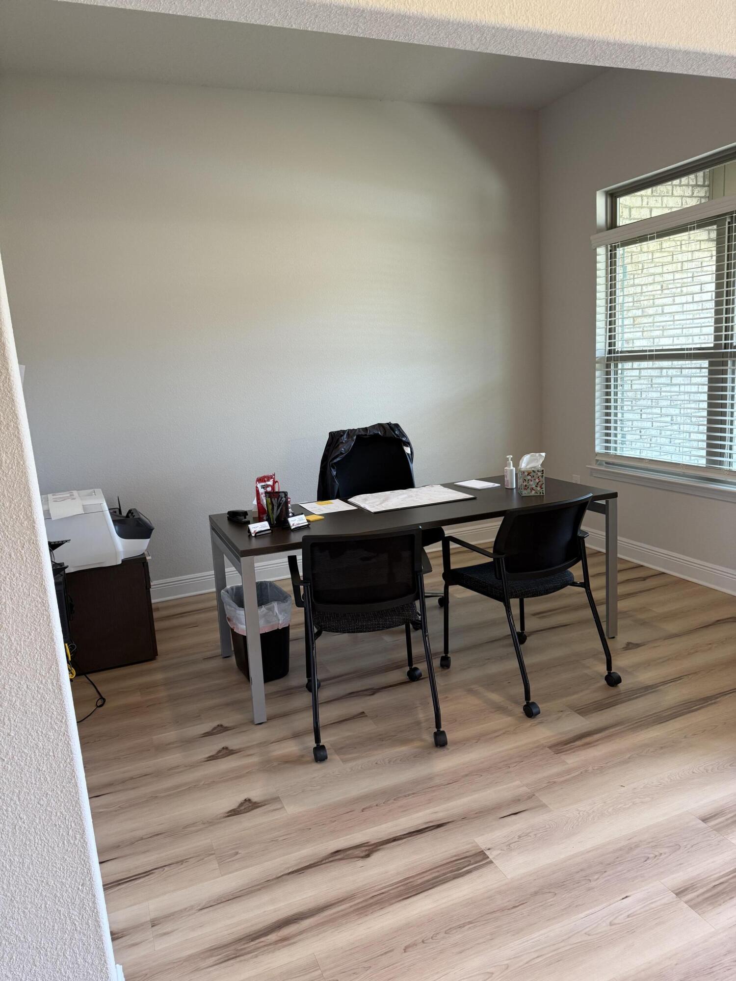 5825 Crestlake Drive Crestview, FL 32536 - Photo 6 of 29 a view of a workspace with furniture and a window