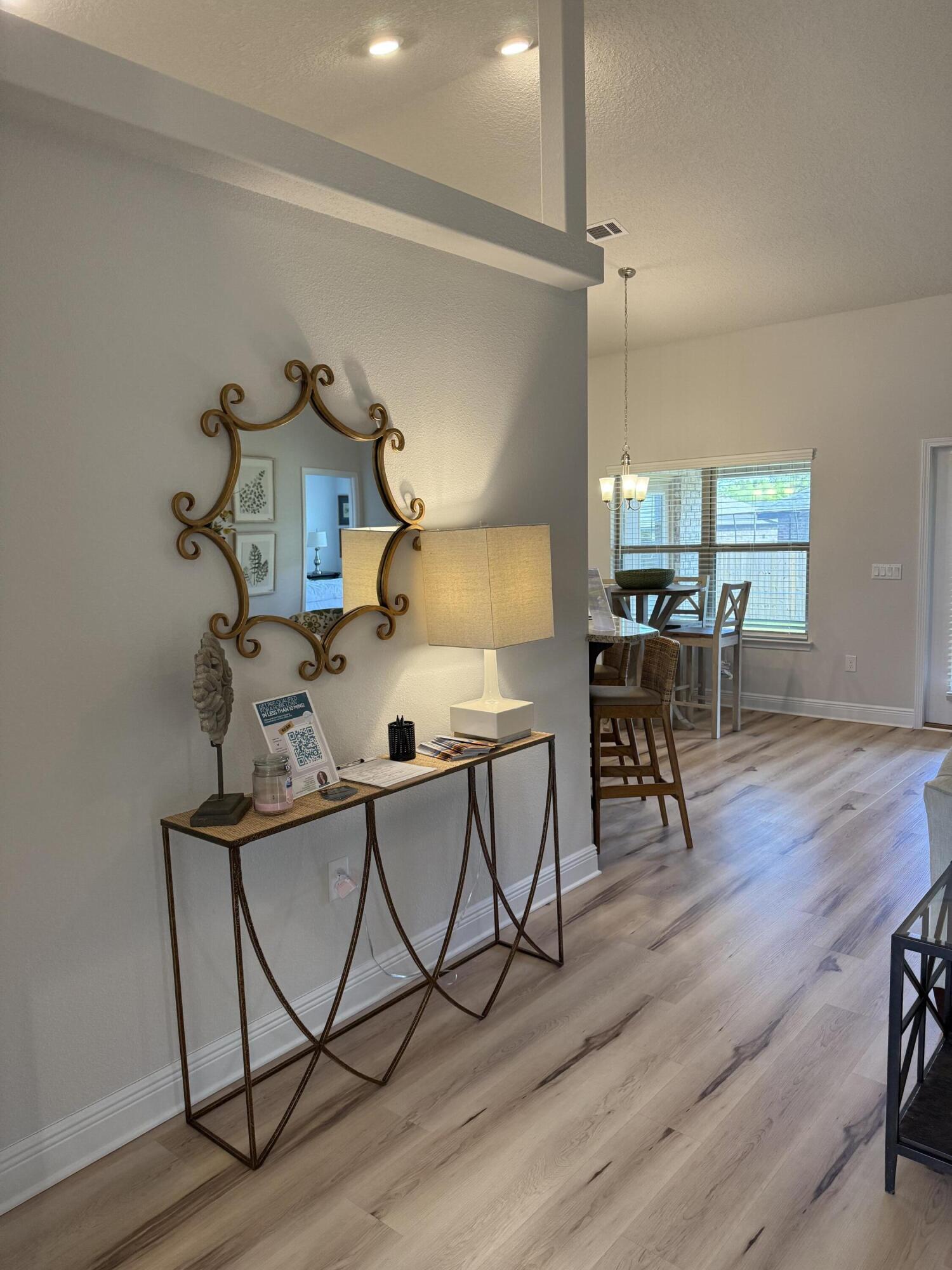 5825 Crestlake Drive Crestview, FL 32536 - Photo 7 of 29 a view of a workspace with furniture and wooden floor
