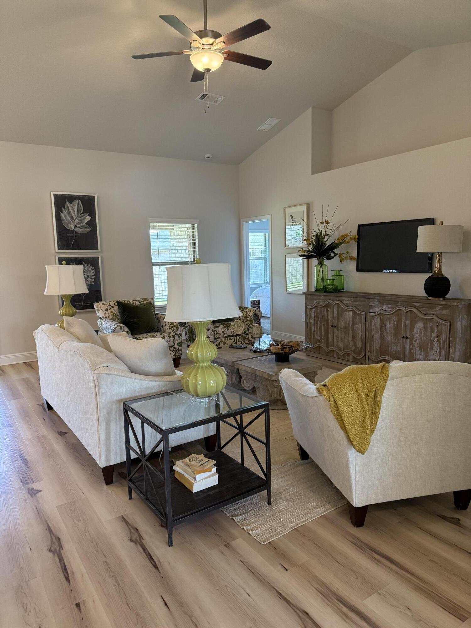 5825 Crestlake Drive Crestview, FL 32536 - Photo 8 of 29 a living room with furniture and wooden floor