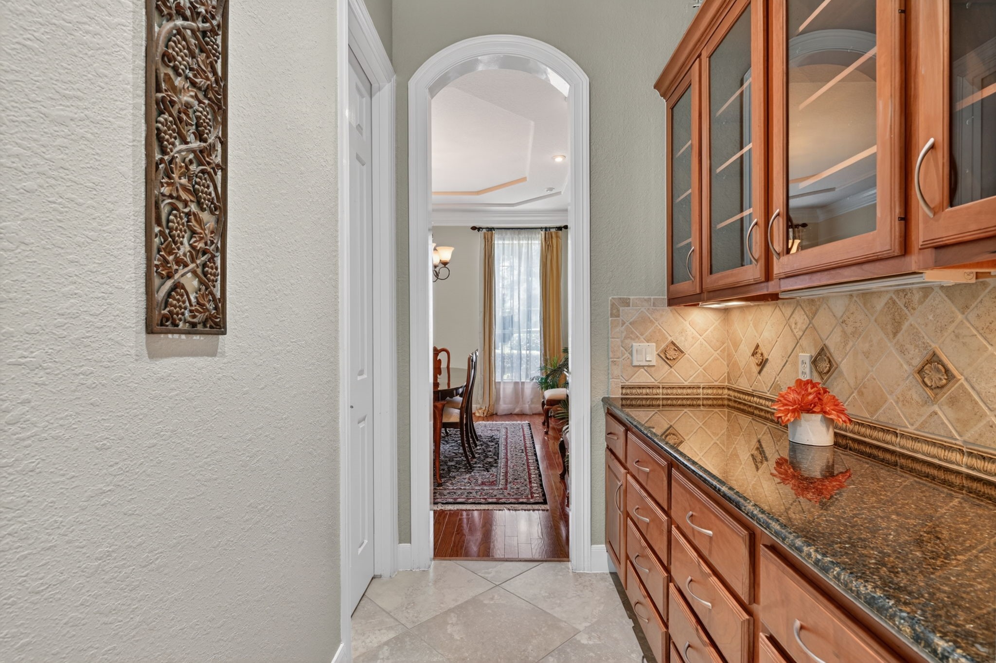 15 White Meadow Court Spring, TX 77379 - Photo 16 of 48 Butler pantry with glass cabinet display fronts and granite tops. Pass through to formal dining room. Multiple drawers for storage. Left door is powder bath.