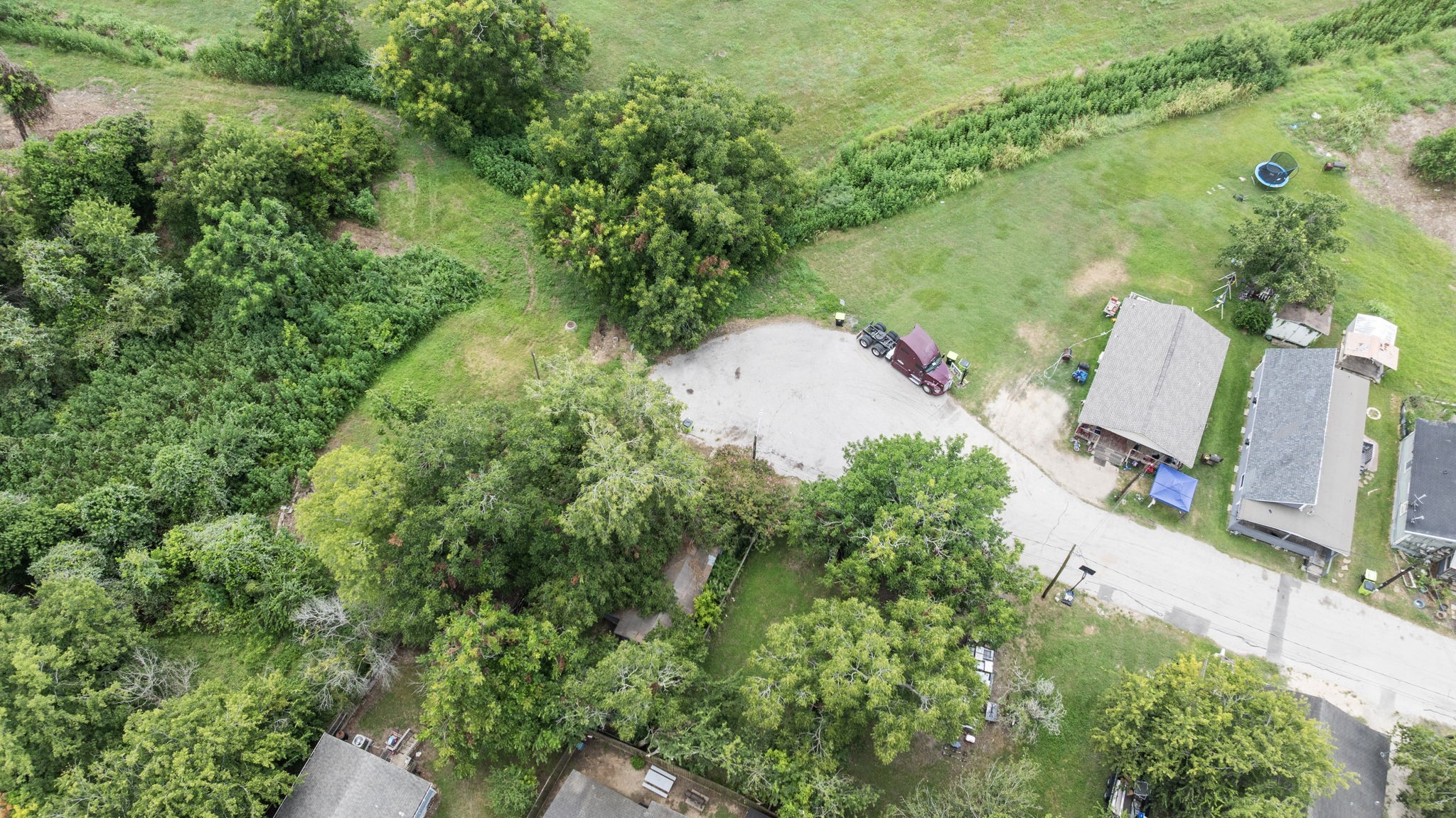 804 Ferry Street Richmond, TX 77469 - Photo 5 of 6 an aerial view of a house with a yard and lake view