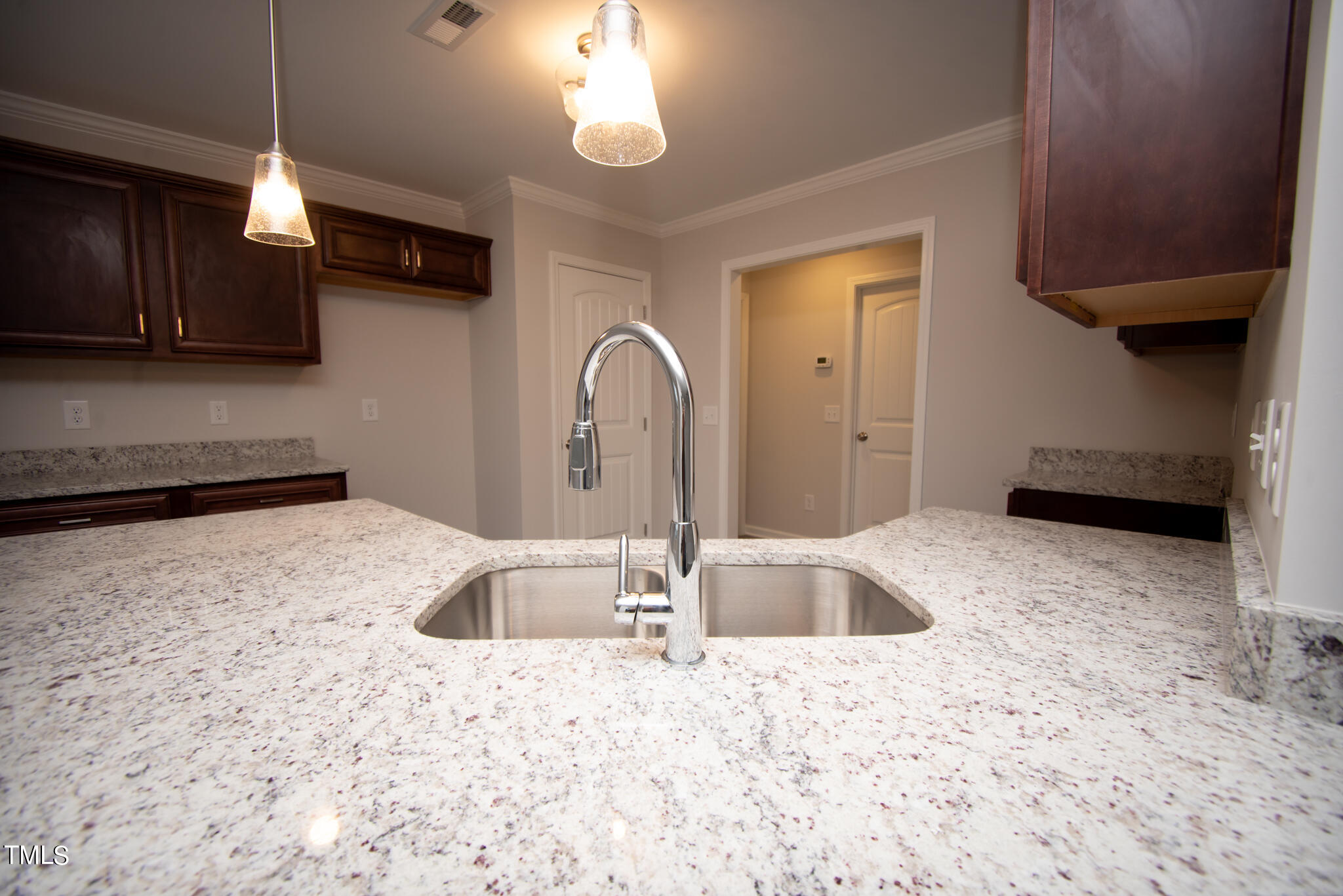 243 Waters Edge Drive Erwin, NC 28339 - Photo 14 of 53 a kitchen with stainless steel appliances granite countertop a sink refrigerator and stove