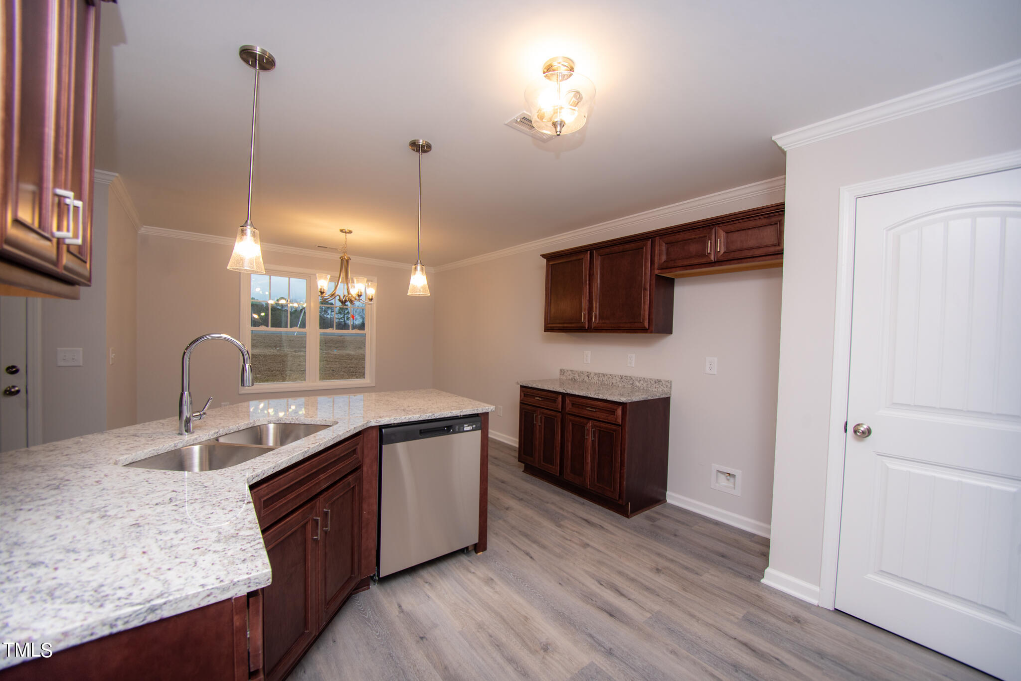 243 Waters Edge Drive Erwin, NC 28339 - Photo 15 of 53 a kitchen with stainless steel appliances granite countertop a sink a stove and a wooden floors