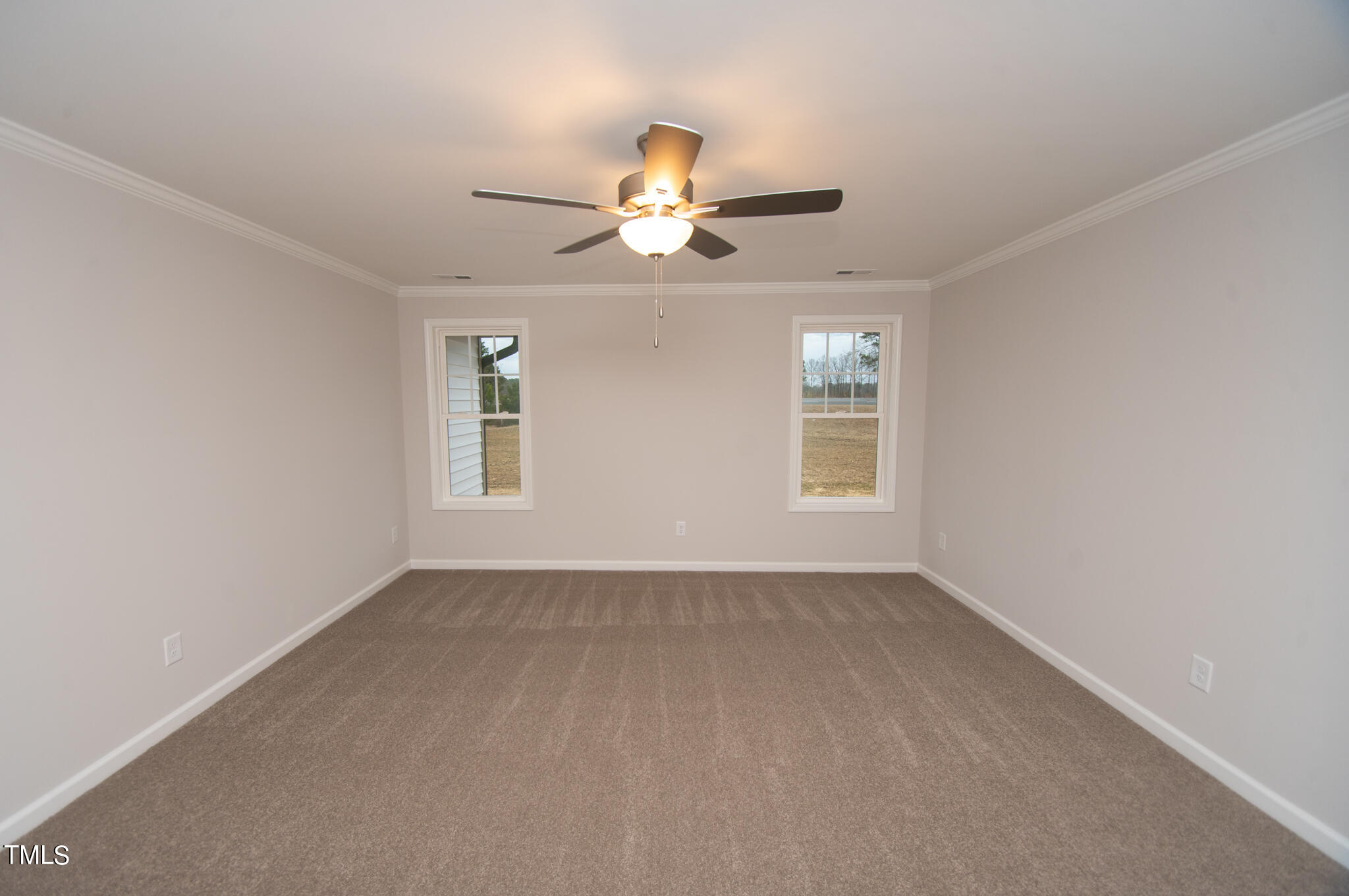 243 Waters Edge Drive Erwin, NC 28339 - Photo 17 of 53 wooden floor in an empty room with a window